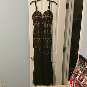 Black lace over nude colored formal dress